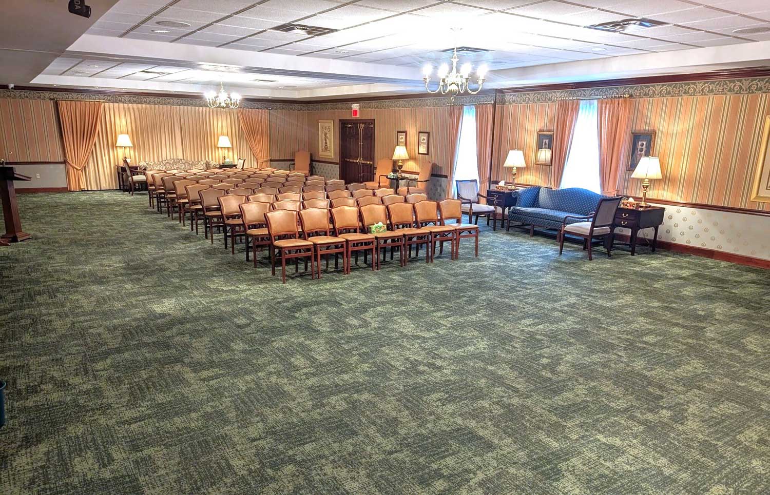 A spacious main chapel with ample lighting and rows of comfortable seats